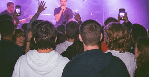 Young people enjoying a live event